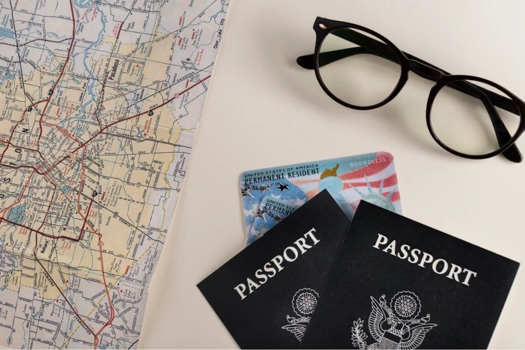 Passports, travel map, and immigration documents representing overseas employment, visa processing, and international travel preparation.